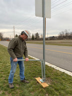 Use a wood board on soft soil